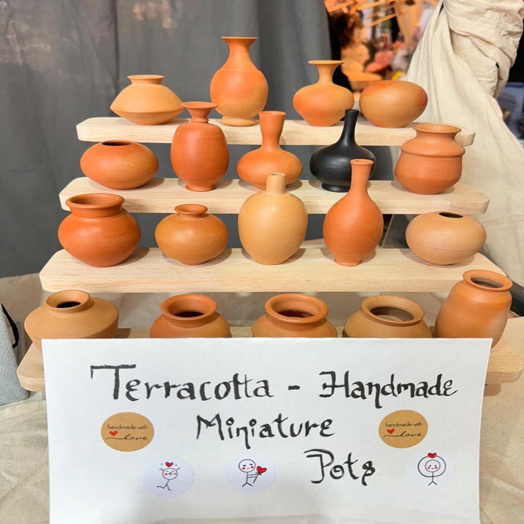 Instagram image with terracotta miniature pots .